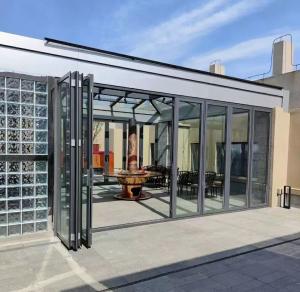 China Fire Retardant 3.0mm Aluminium Bifold Patio Doors Slide Folding Glass Door on sale