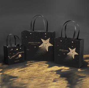 China Black Stamping Star Shopping Bag Customized Logo Printed Tote Paper Gift Bags on sale