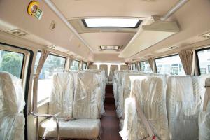  7.7 Meter 31 Passenger Luxury Tour Coaster Minibus Coach Low Gross Weight Manufactures